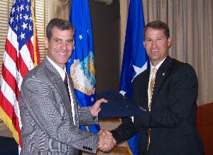 In August, Bill Marion (r), chapter president, presents a chapter polo shirt to Brig. Gen. Robert Yates, USAF, former director for operations, plans, logistics and engineering, U.S. Joint Forces Command.